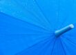 Beading on blue umbrella