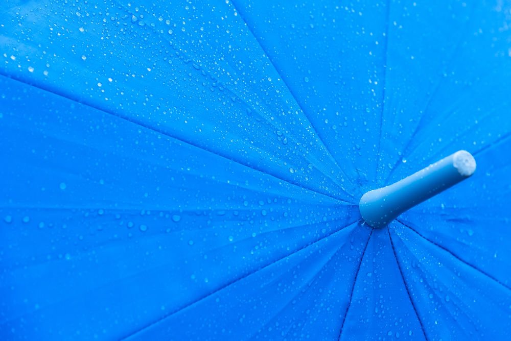 Beading on blue umbrella