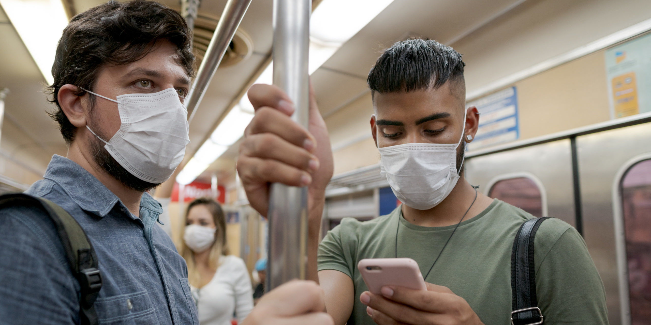 Students and travelers using public transport for commuting. Covid-19 and CoronaVirus concept. People wearing masks on the train. Students and travelers using public transport for commuting. Covid-19 and CoronaVirus concept. People wearing masks on the train.